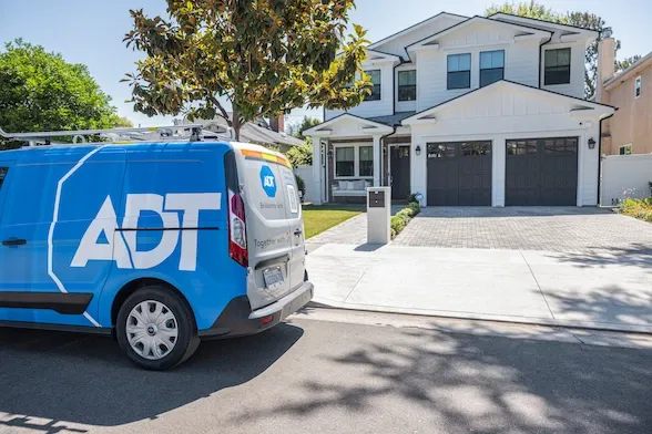 ADT installer van in front of home
