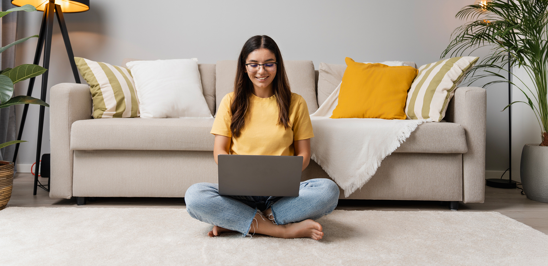 Happy woman tests her internet speed at home.