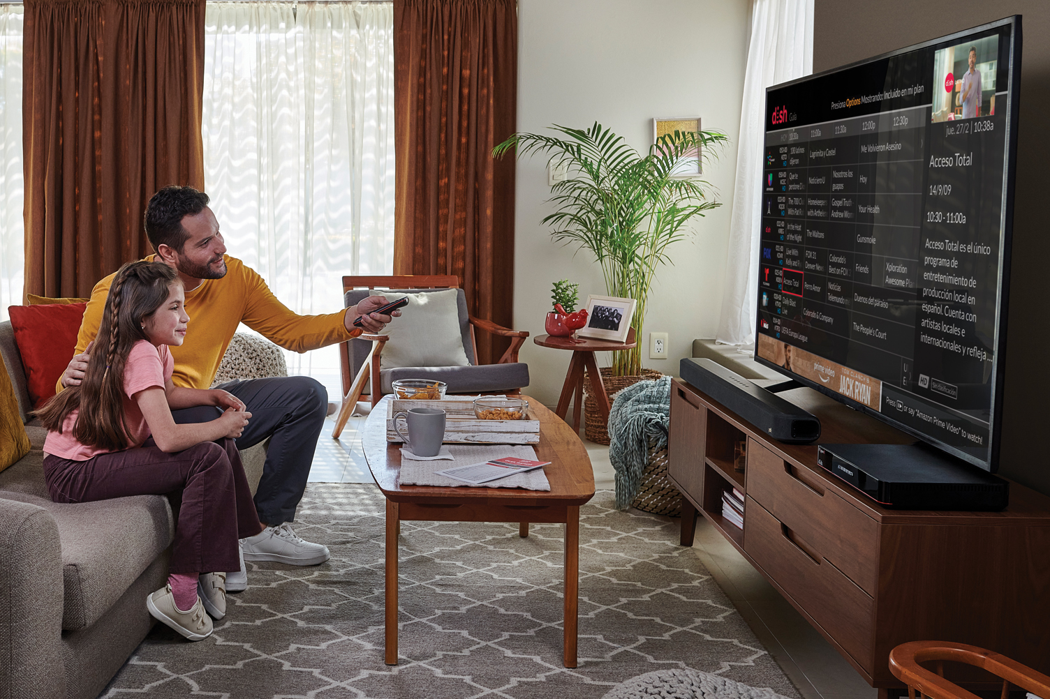 Father and daughter watching TV