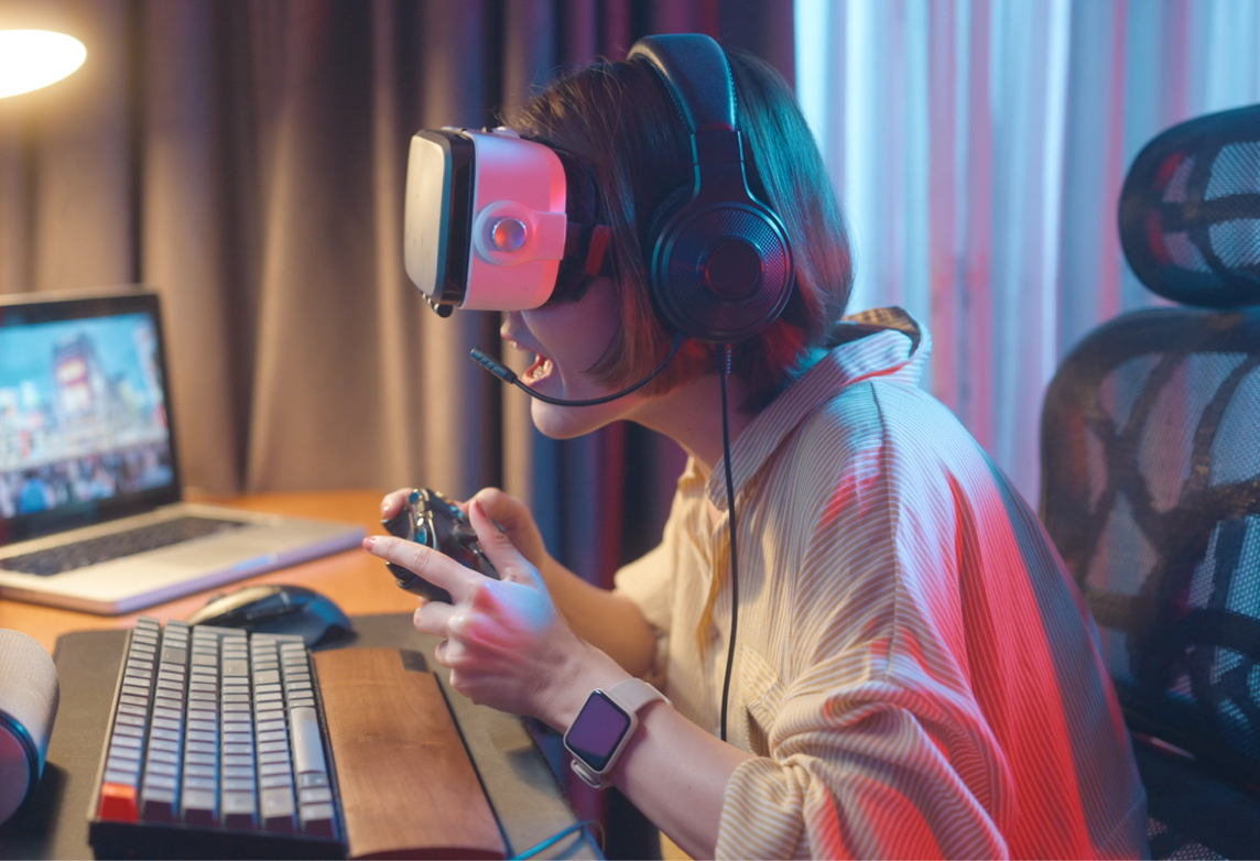 Woman games at home with technology.