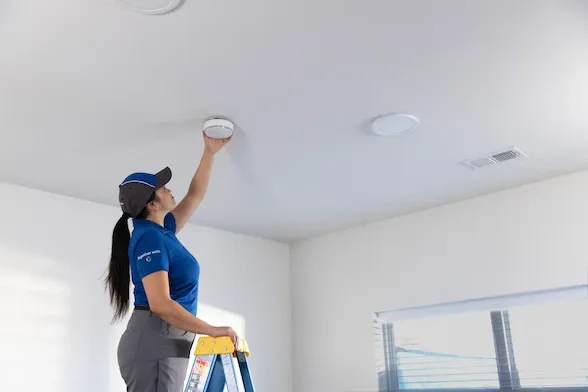 ADT employee installing sensor