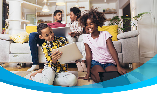 Happy family uses fast fiber internet at home.