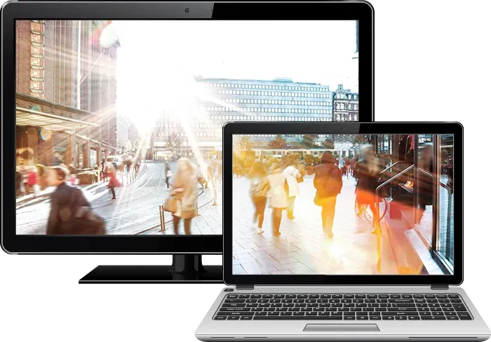 tv and laptop with city image