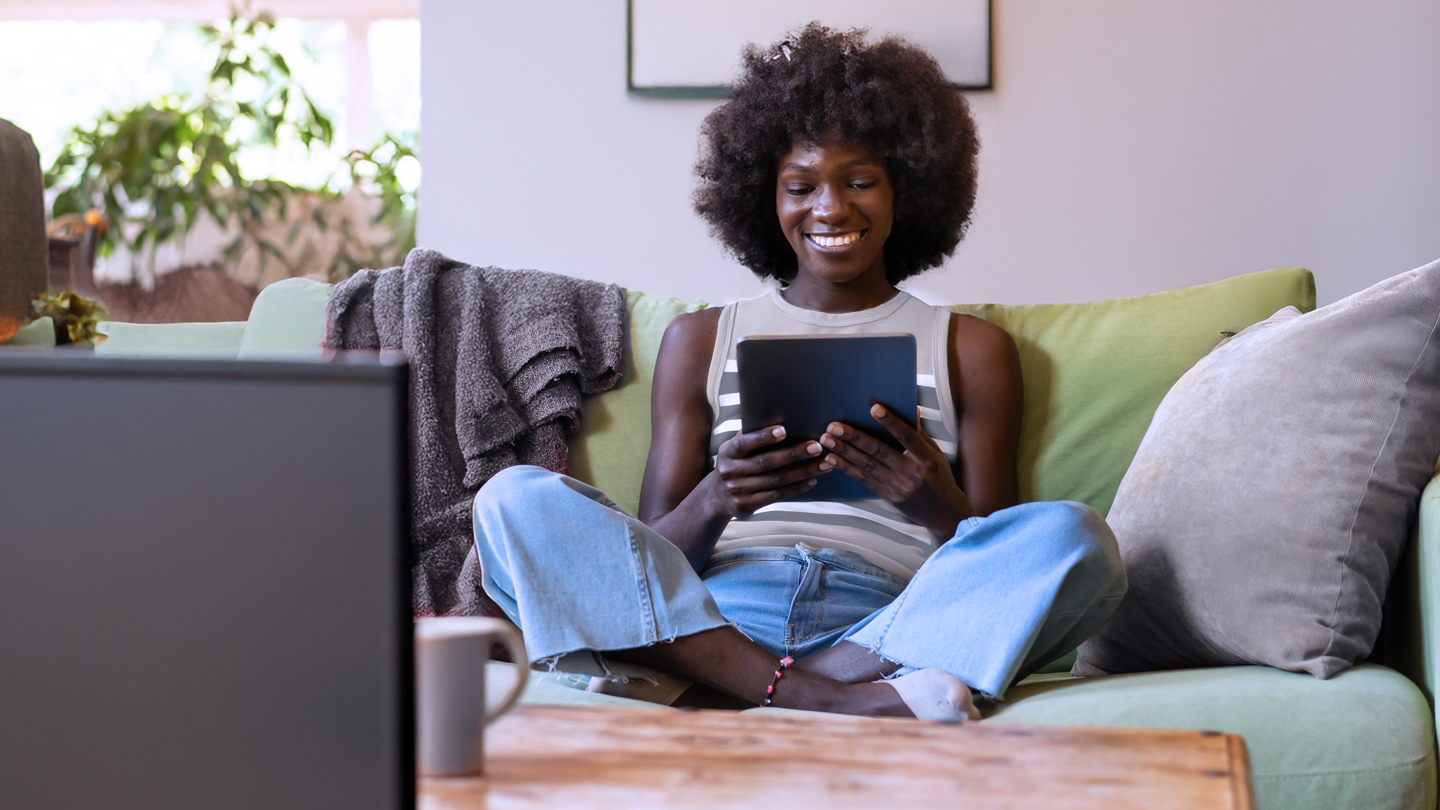 Woman using internet and watching tv