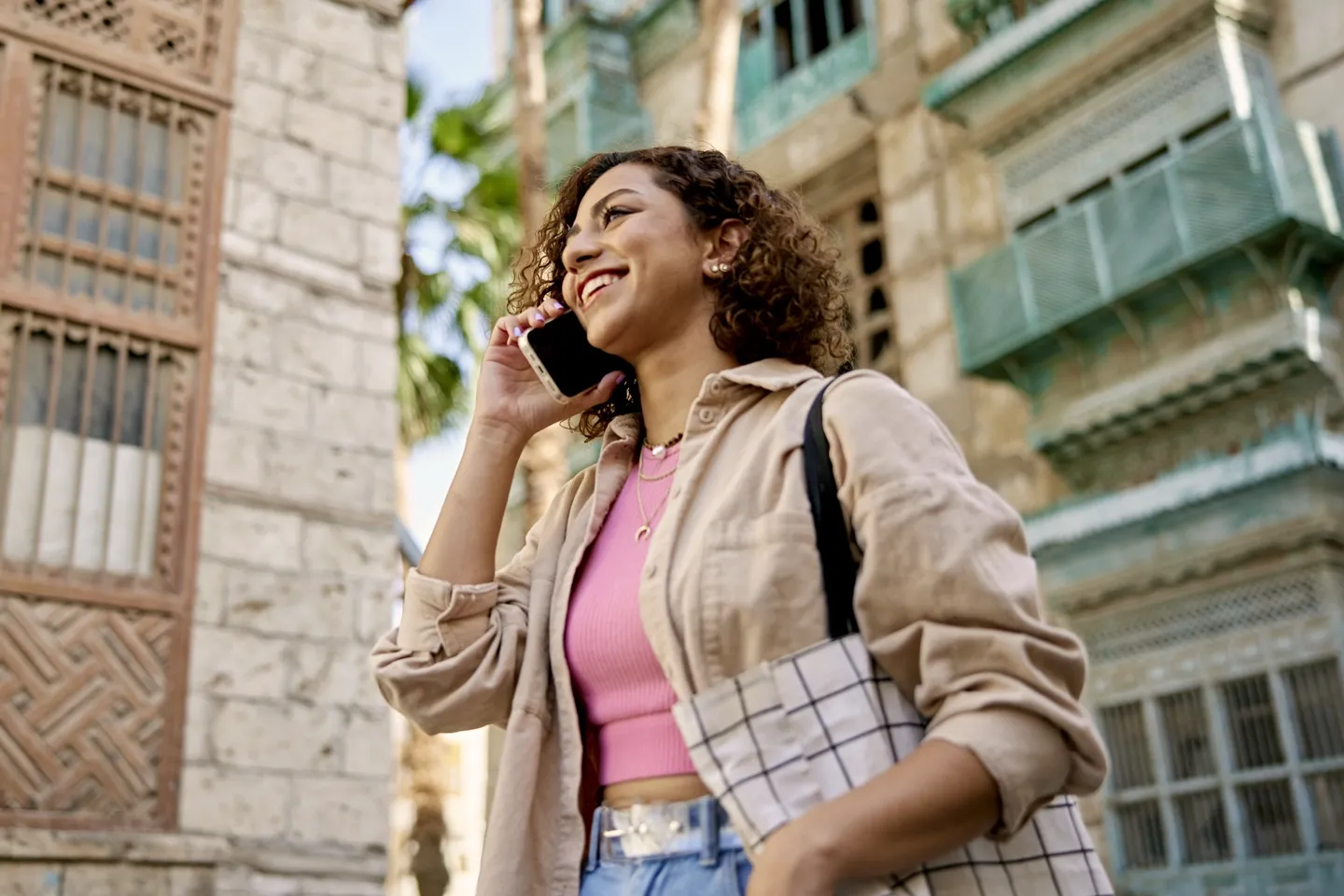 Gal out on the town chatting on her phone.
