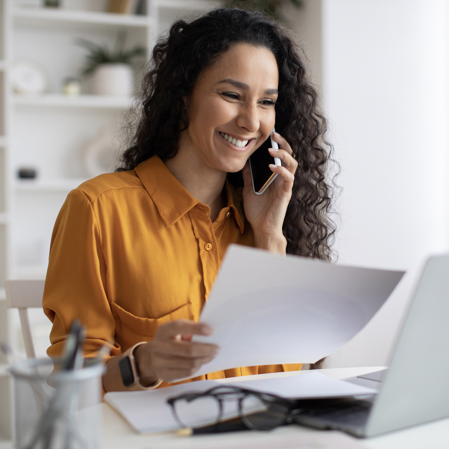 Woman in yellow blouse calling customer service
