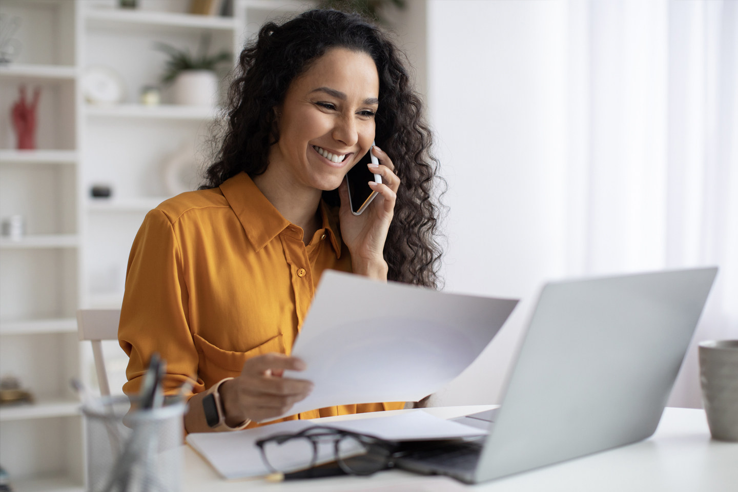 Woman in yellow blouse calling customer service