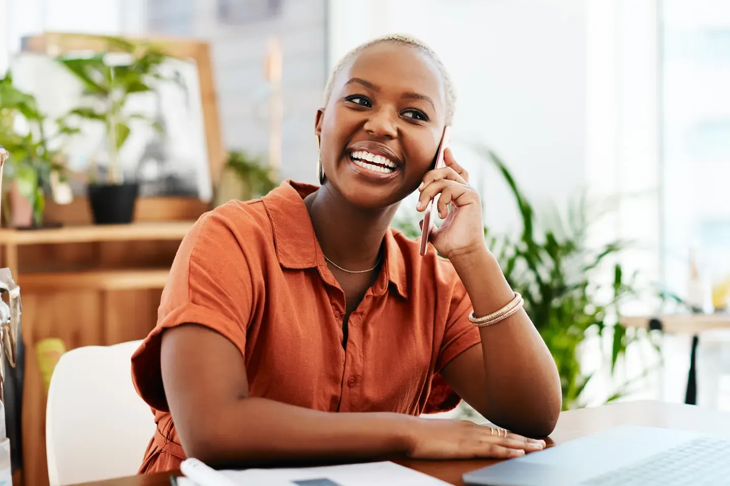 Smart looking business woman chatting on her smart phone.