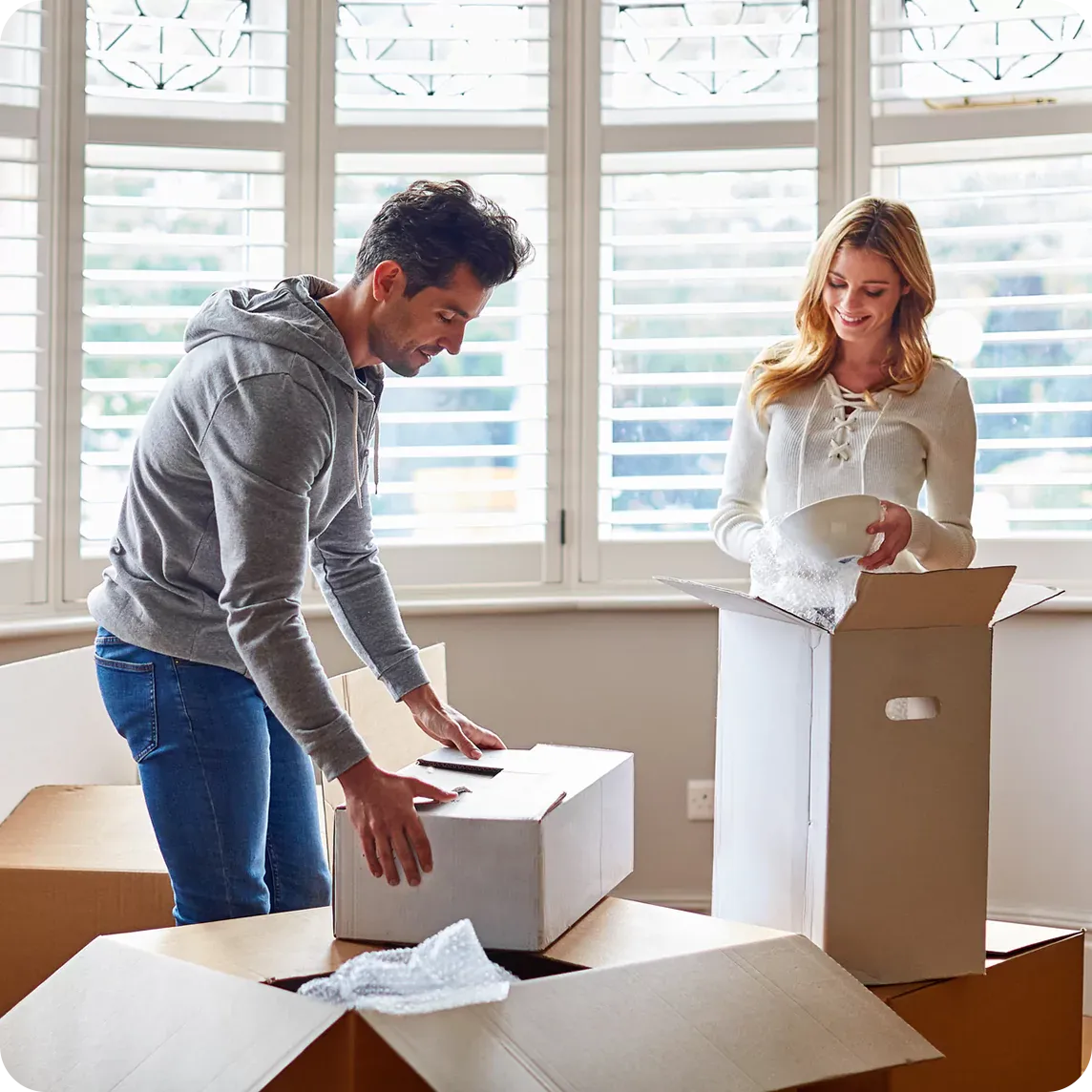 A couple with moving boxes