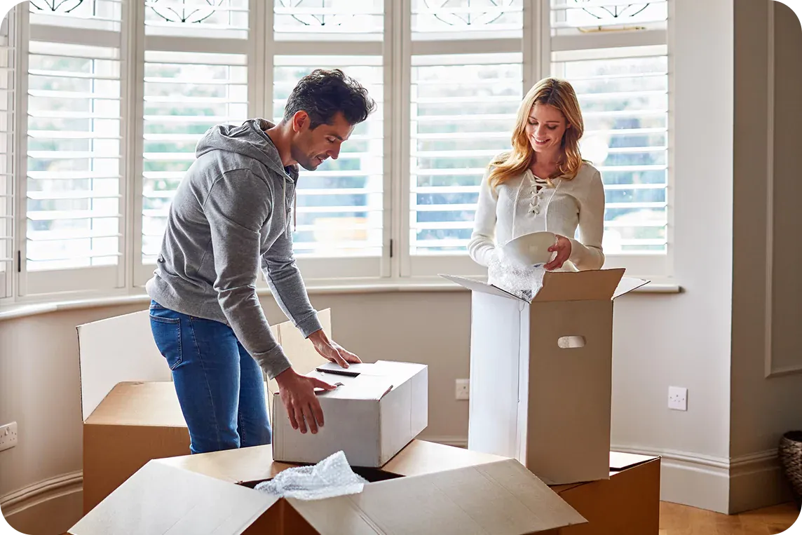 A couple with moving boxes