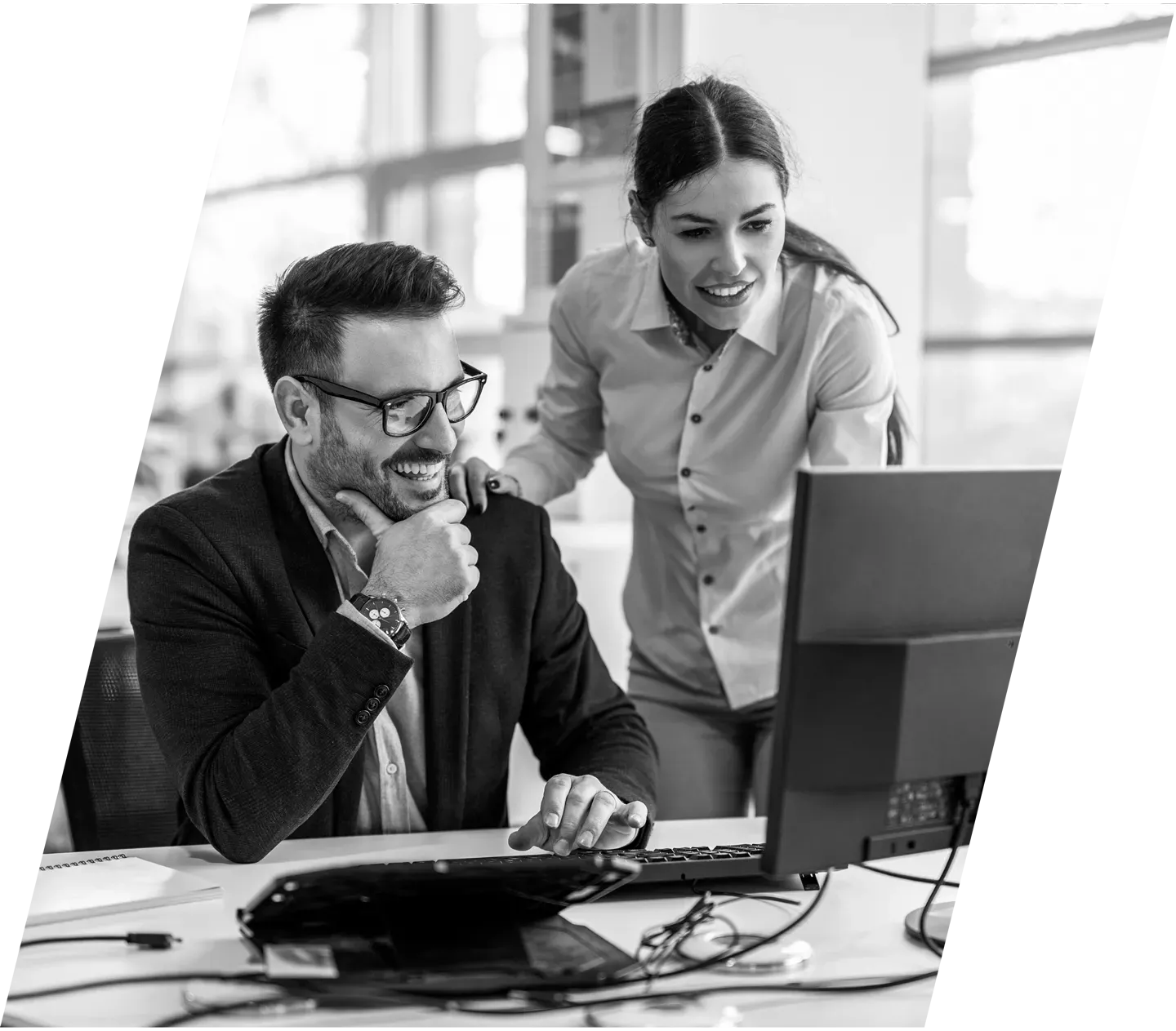 co-workers looking at a computer screen together
