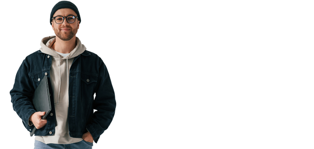 Guy wearing a beanie and holding a laptop under his arm