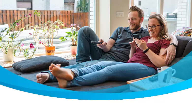 caucasian watching tv on couch