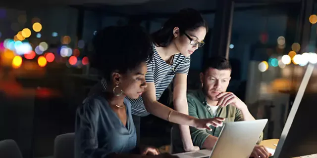 Coworkers collaborating at the office.