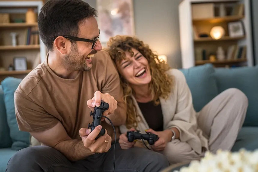 couple playing video games at home