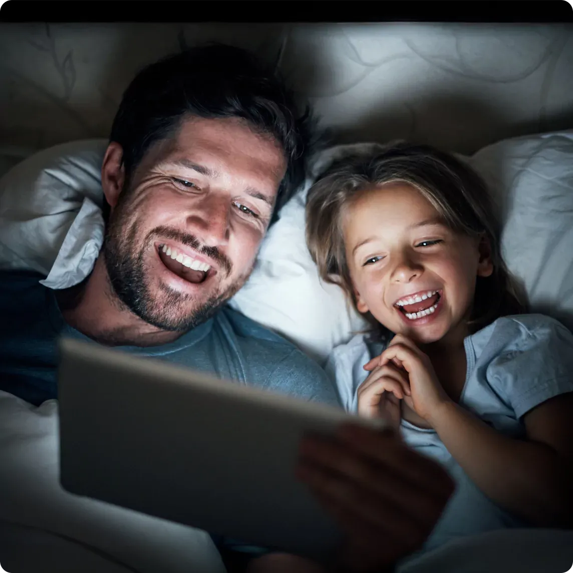 Daddy and daughter streaming a show.