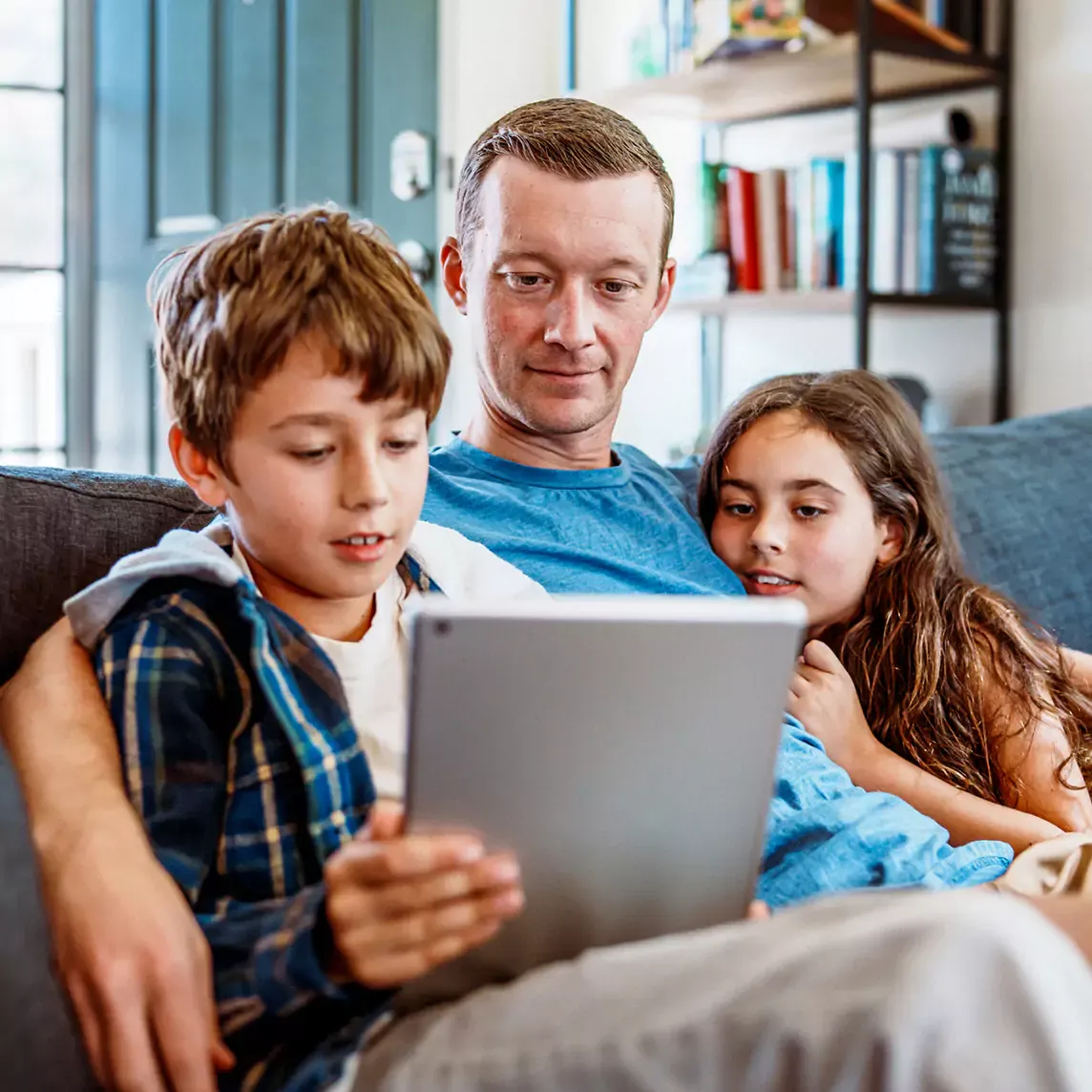 dad and kids streaming show on tablet