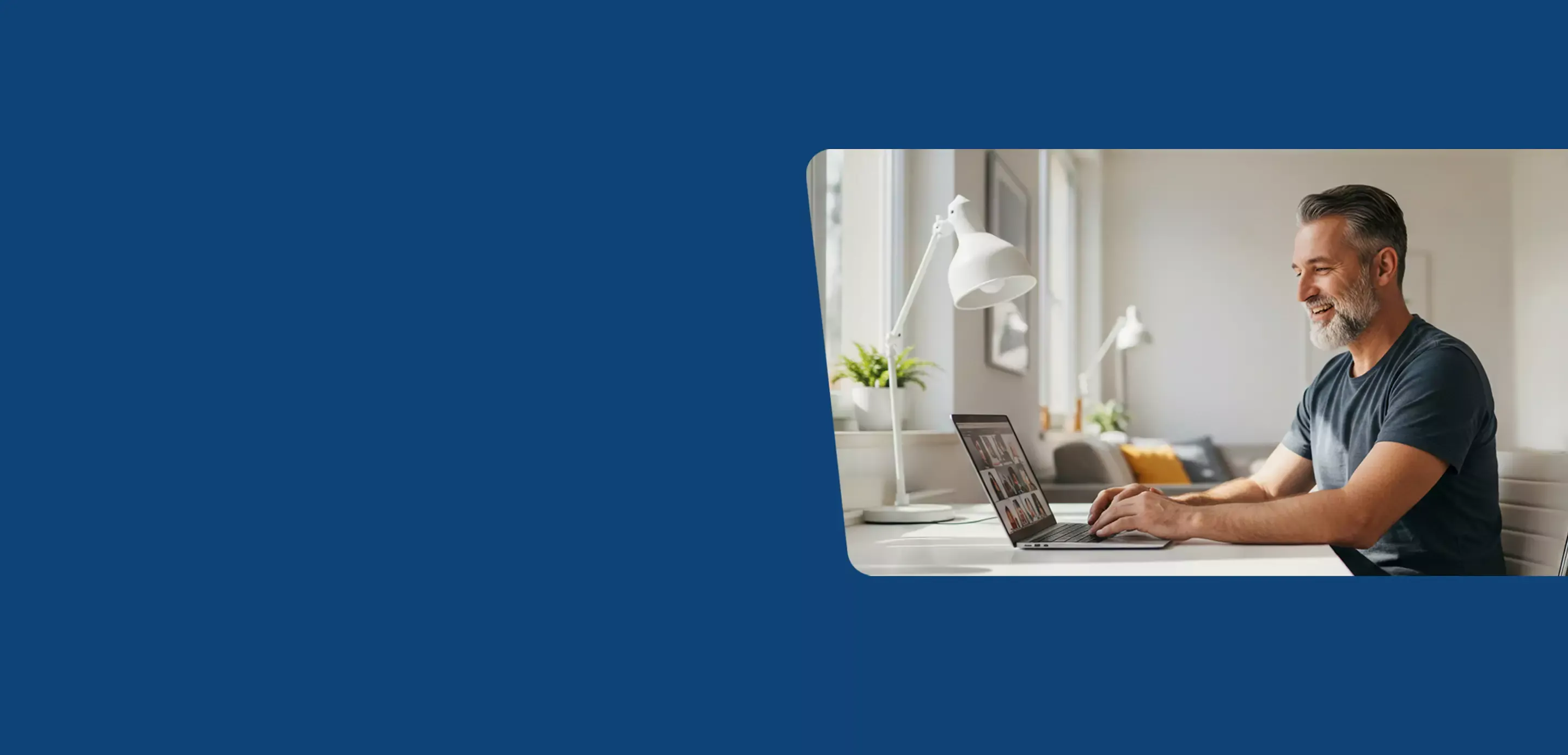 Man uses laptop for virutal call in home office