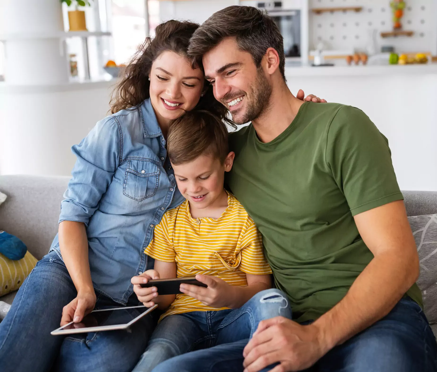 Happy family uses devices with fast internet.