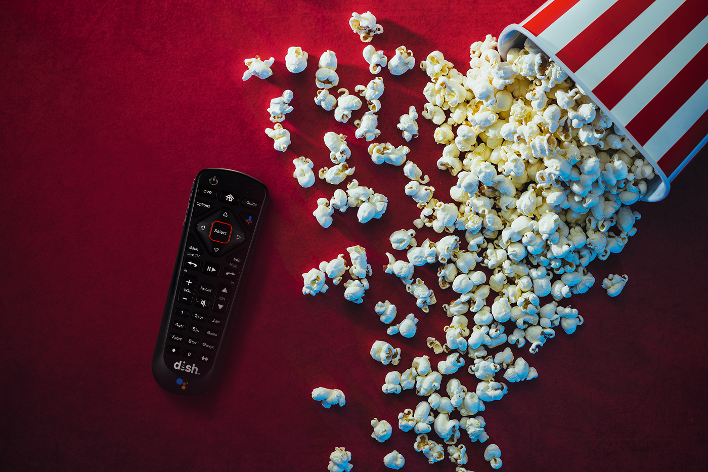 popcorn spilled next to DISH remote