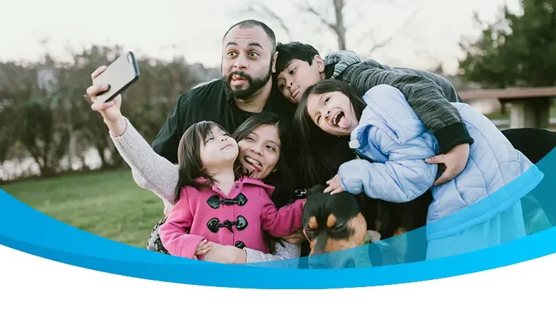 Family taking a selfie with smartphone