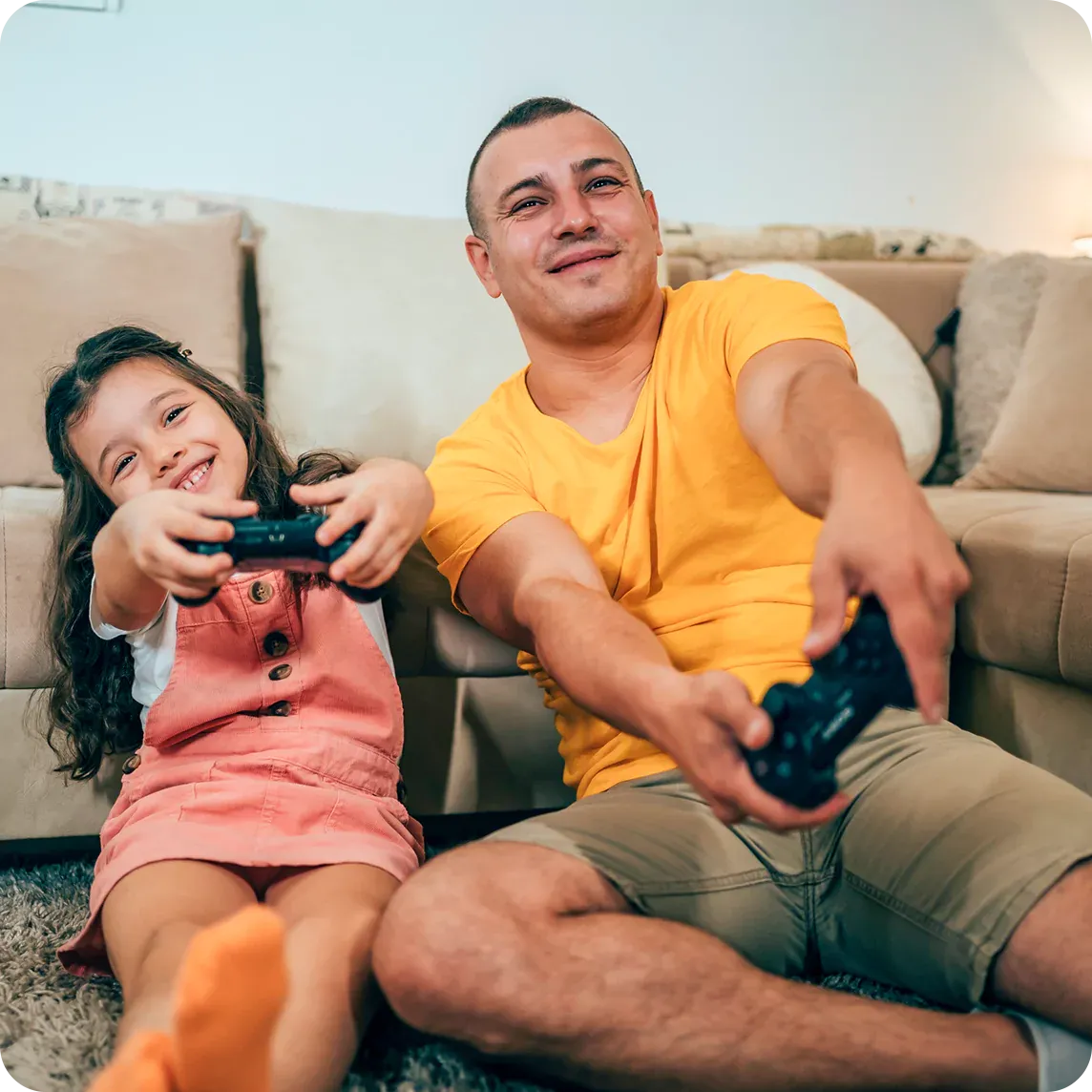father and daughter playing video games