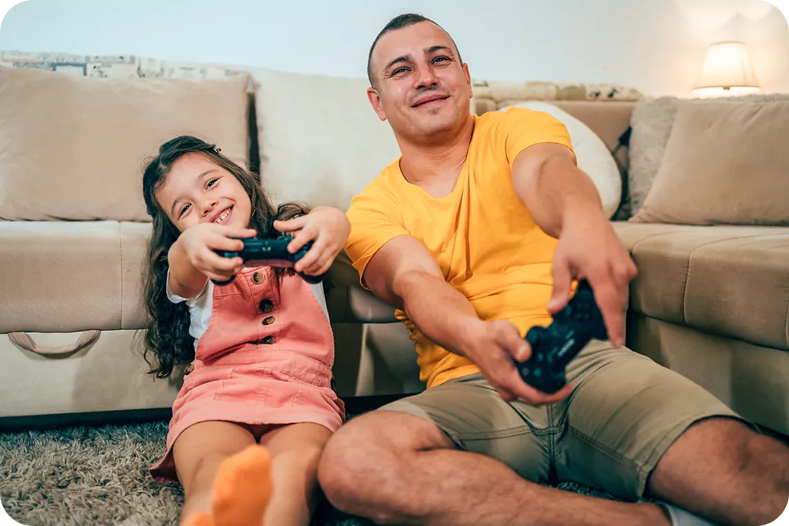 father and daughter playing video games