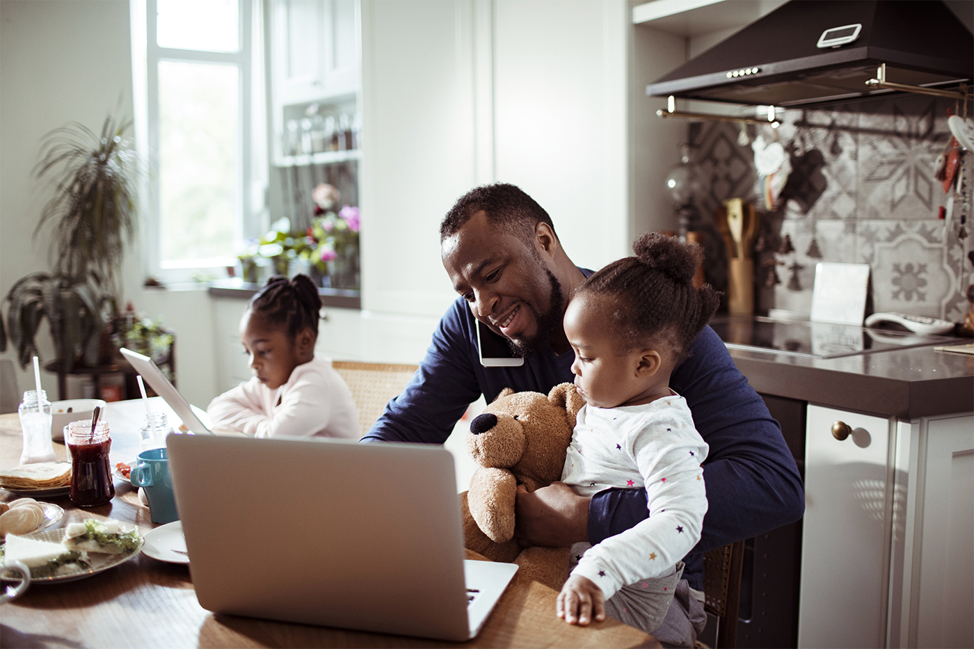 Father working from home in kitchen