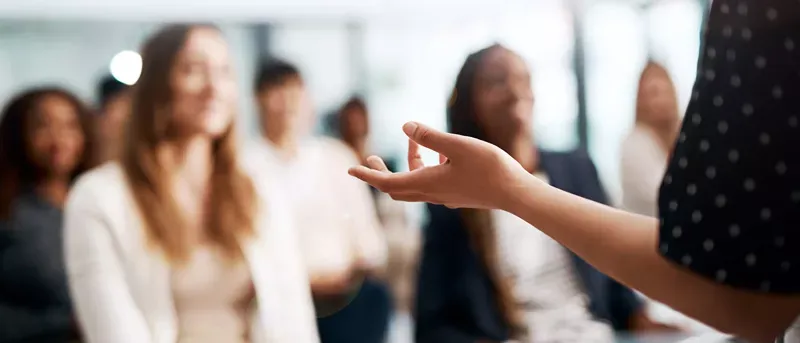 Teacher explaining proper prononciation.