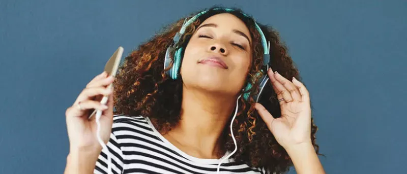 Woman listening to her favorite songs on her favorite streaming service.