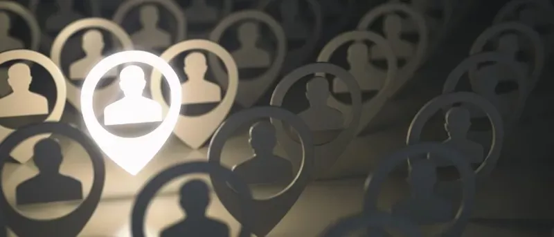 A digital illustration showing a crowd of identical, silhouetted human figures inside map pin icons, with one pin in the foreground glowing brightly, suggesting a highlighted person or a singled-out individual.