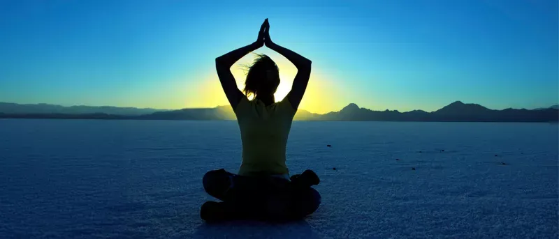 Person practicing yoga for their wellness.