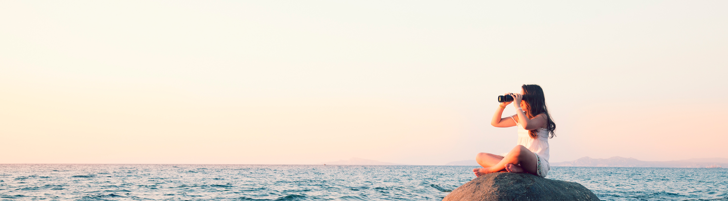 girl looking through binoculars
