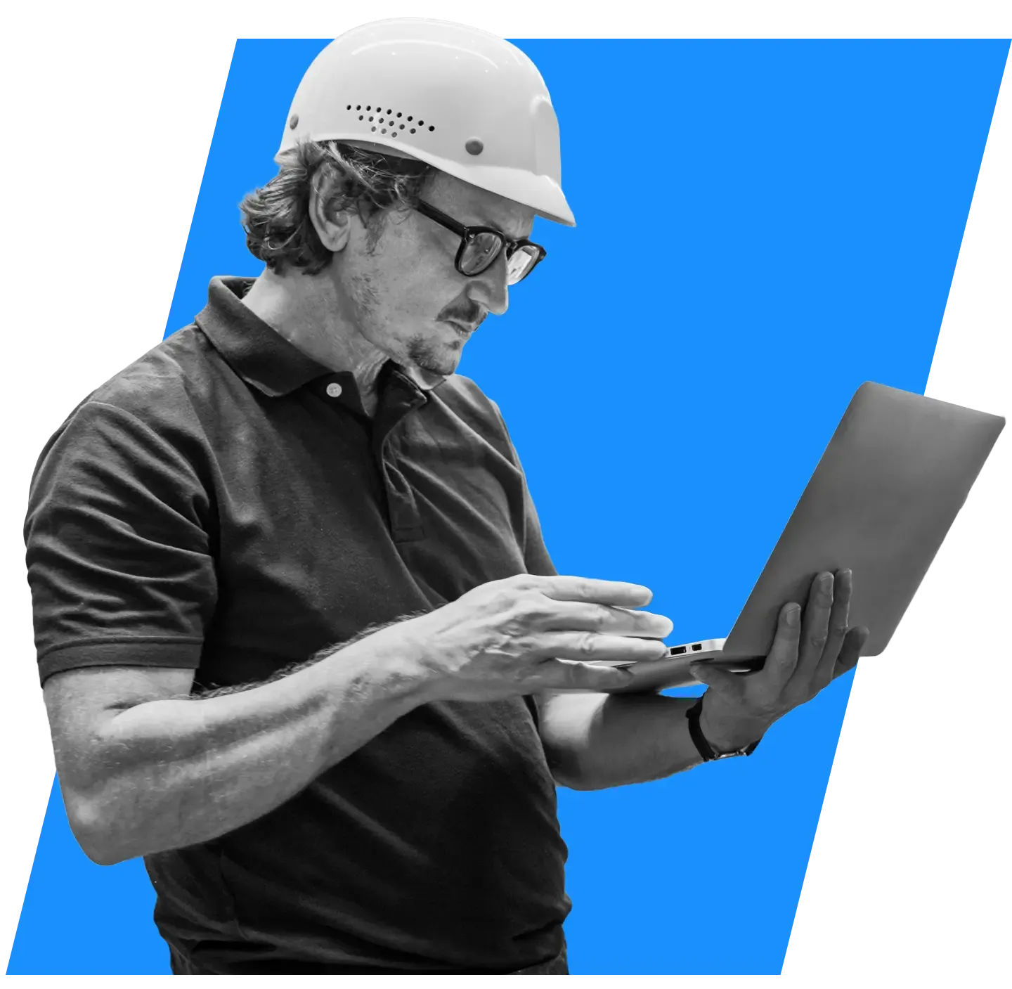 IT professional in a hard hat with a laptop