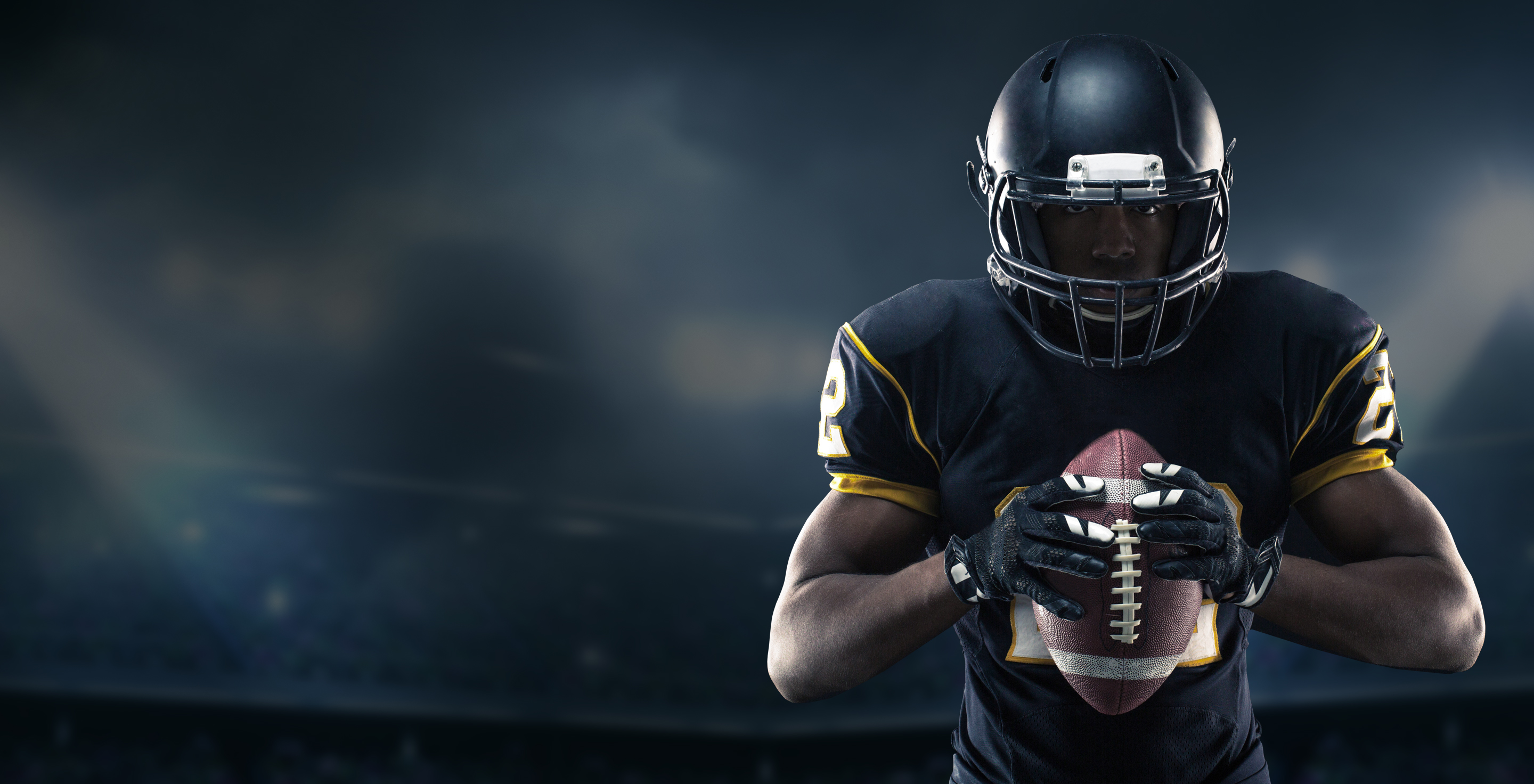 Football player holding football