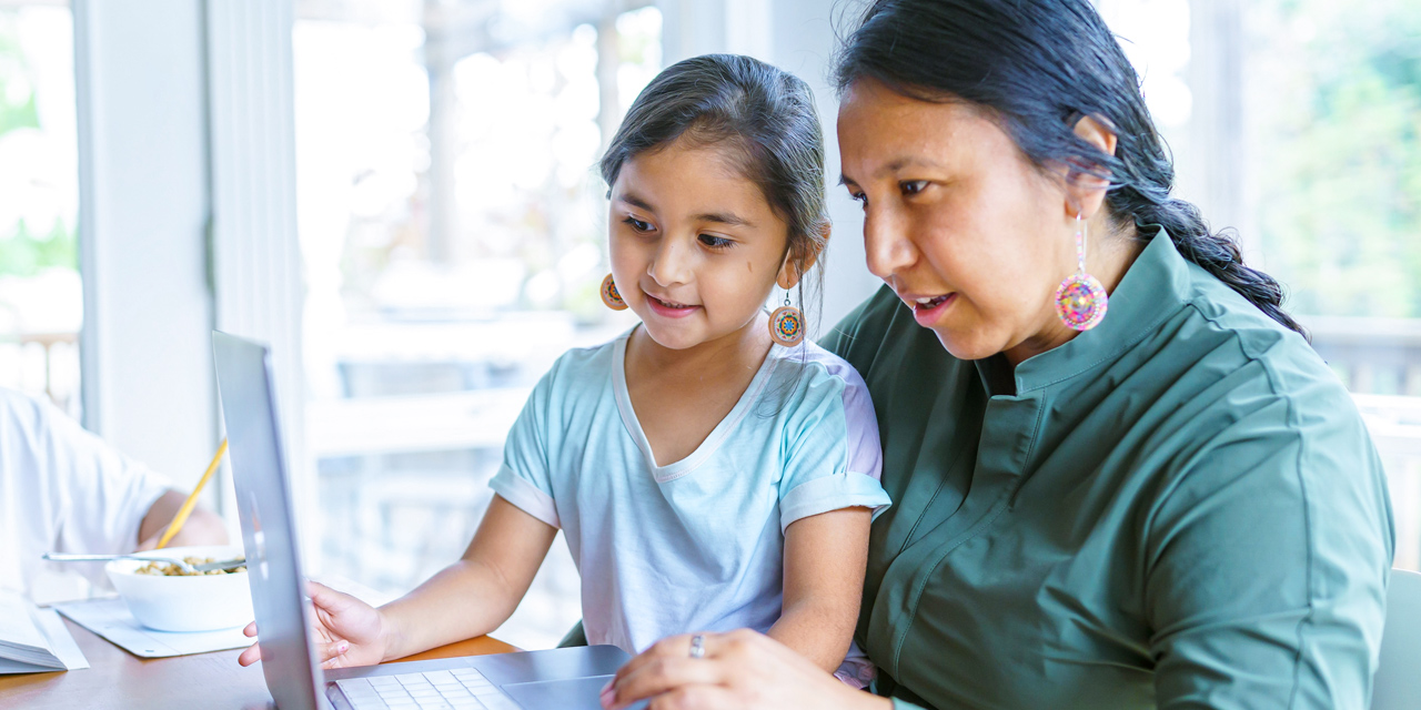 Mom and daughter using CenturyLink internet to do home work