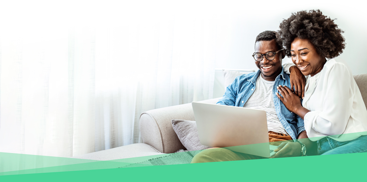 husband and wife using a laptop connected to CenturyLink internet