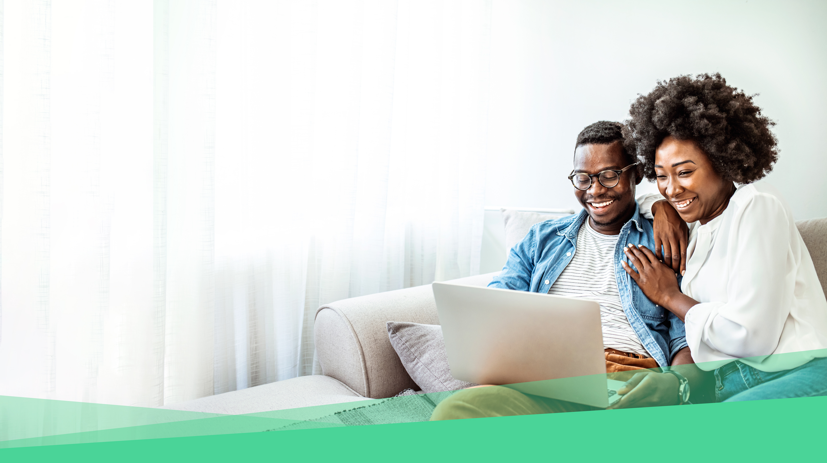 husband and wife using a laptop connected to CenturyLink internet