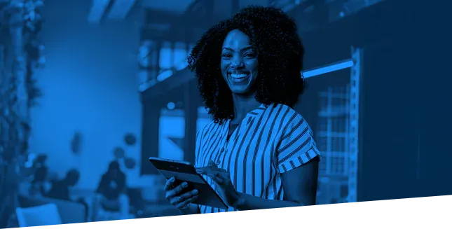 Smiling woman in stripped shirt holding a tablet