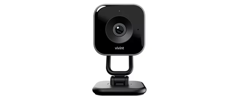 A Vivint Indoor Camera Pro, a small, black, square camera on a stand, is centered against a white background.