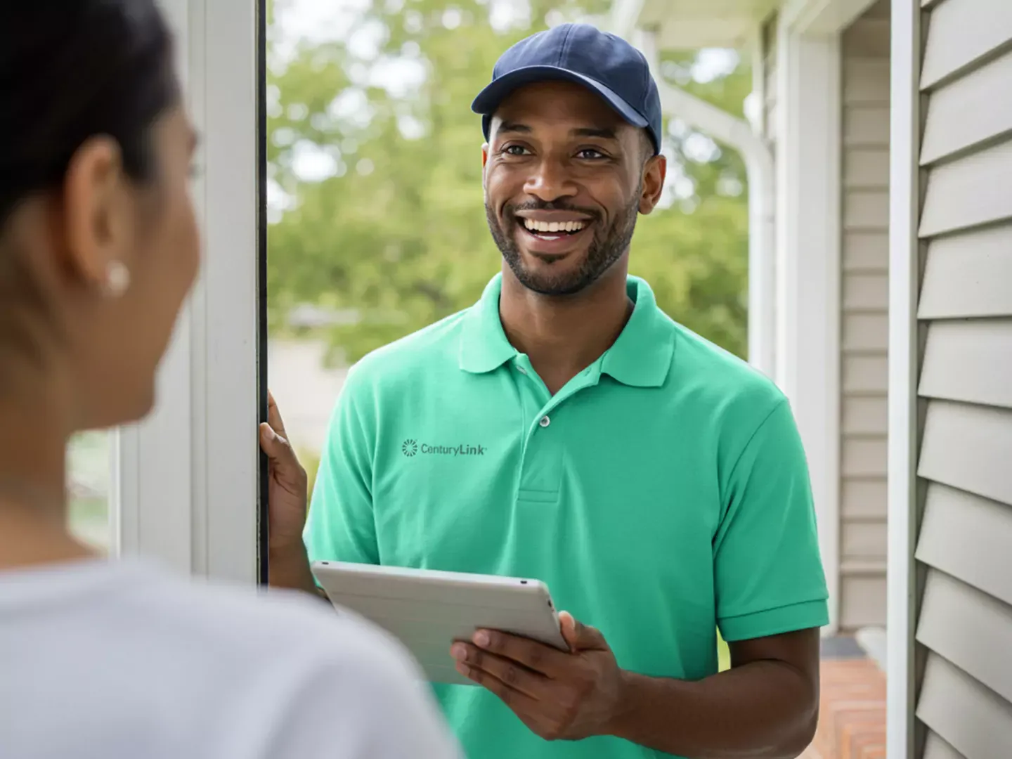 Smiling installer at the door, ready to help hook up your internet.