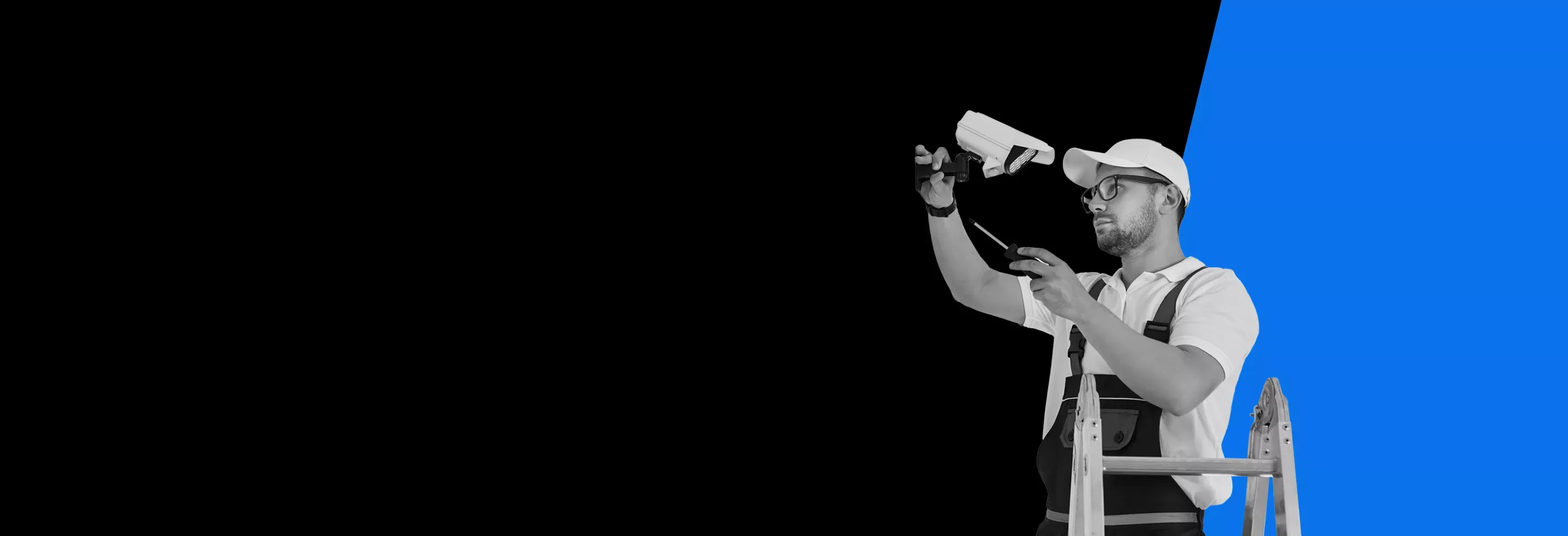 man installing a security camera