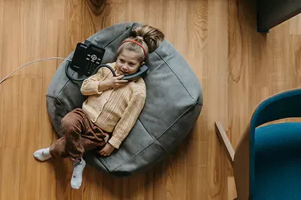little girl talking on home phone