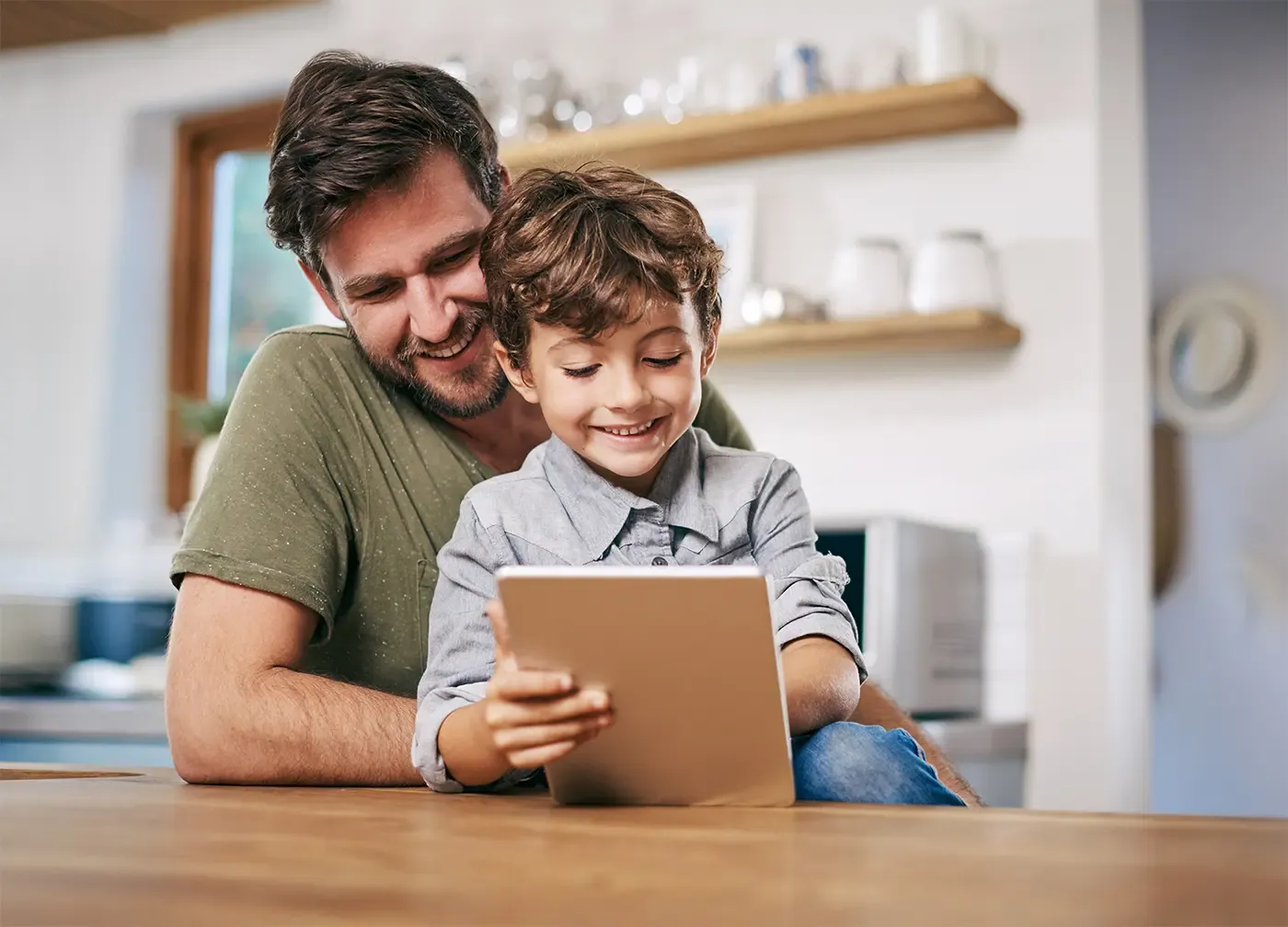 Father and son using a tablet