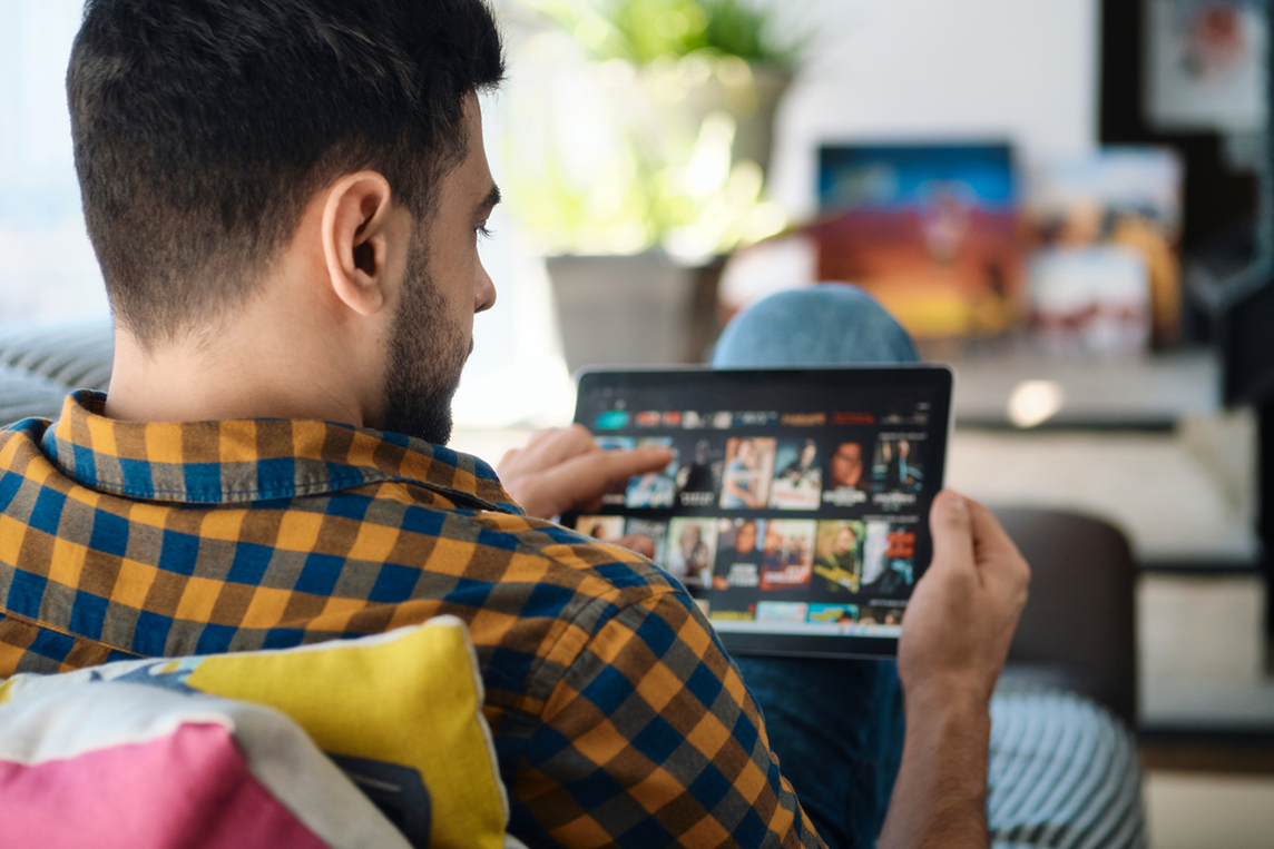 man streaming a show with at&t internet