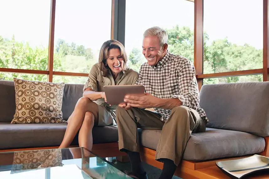 Mature couple looking at a digital tablet