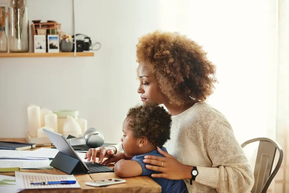 Mom with baby looking at iPad
