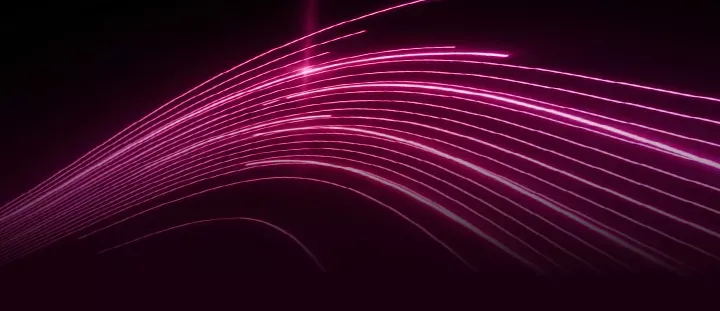 Abstract image showing bright pink light trails curving across a completely black background.
