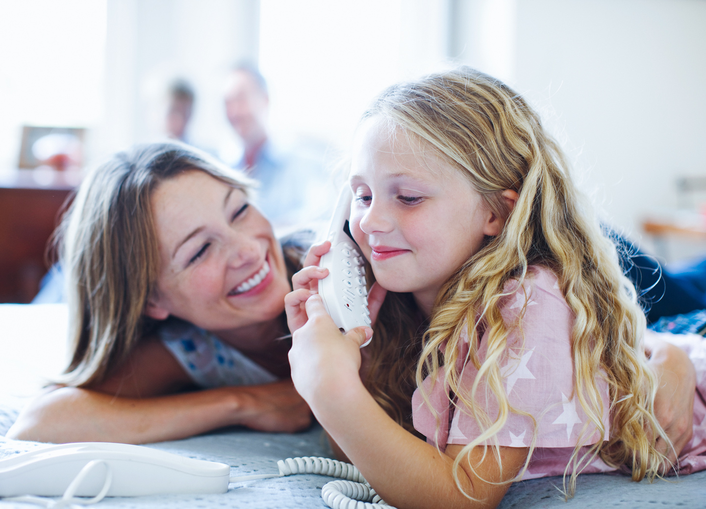 mom and daughter enjoying a phone call using CenturyLink home phone service