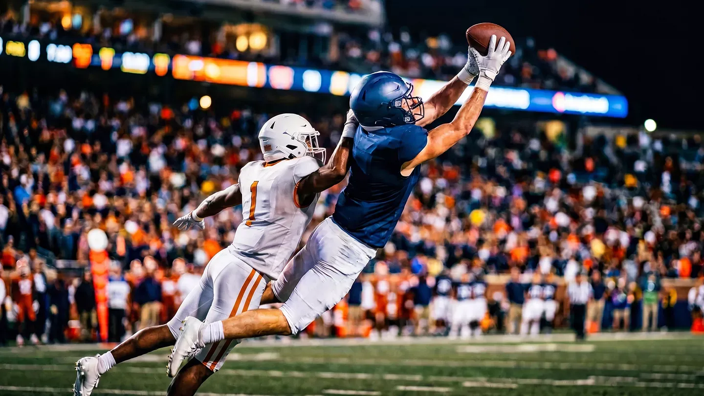 Professional football player jumping for the catch